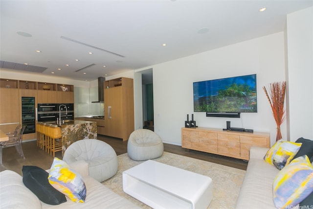 1118 Ala Moana Blvd Unit 2, Honolulu, HI 96814 - living room featuring wood finished floors, recessed lighting, and beverage cooler