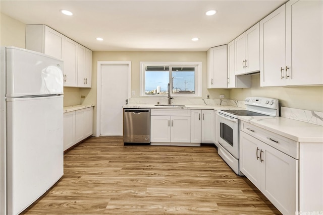 2017 Liliha St, Honolulu, HI 96817 - kitchen featuring white appliances, a sink, white cabinets, and recessed lighting
