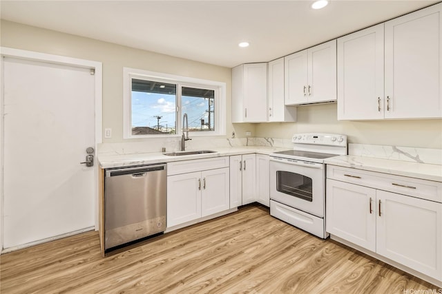2017 Liliha St, Honolulu, HI 96817 - kitchen with dishwasher, white electric range oven, a sink, white cabinets, and light wood-style flooring