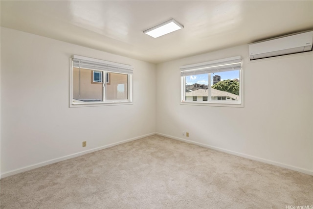 2017 Liliha St, Honolulu, HI 96817 - spare room featuring a wall mounted air conditioner, carpet, and baseboards