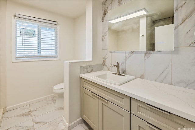 2017 Liliha St, Honolulu, HI 96817 - bathroom with marble finish floors, baseboards, vanity, and toilet