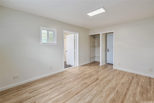 2017 Liliha St, Honolulu, HI 96817 - unfurnished bedroom with light wood-style flooring, baseboards, and a closet