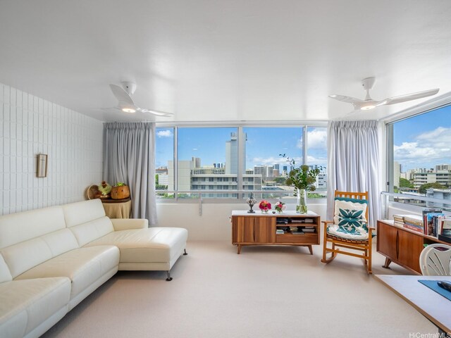 1545 Nehoa St Unit 402, Honolulu, HI 96822 - carpeted living room featuring ceiling fan, a city view, and plenty of natural light