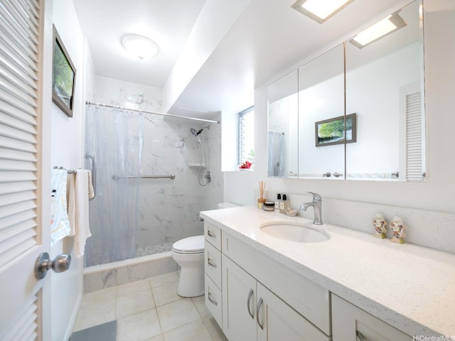 1545 Nehoa St Unit 402, Honolulu, HI 96822 - bathroom featuring vanity, toilet, a marble finish shower, and tile patterned flooring