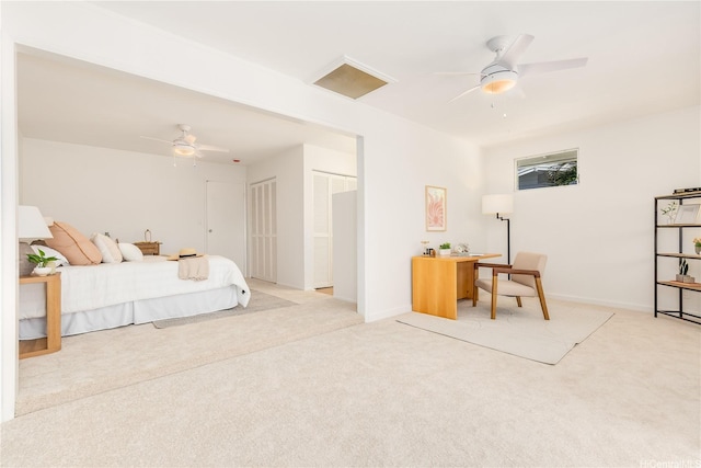 252 Anapalau St, Honolulu, HI 96825 - bedroom with light carpet, a desk, ceiling fan, and two closets