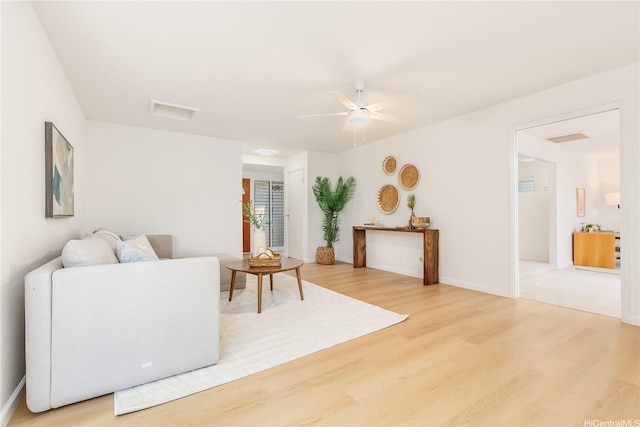 252 Anapalau St, Honolulu, HI 96825 - living area featuring light wood finished floors, ceiling fan, and baseboards