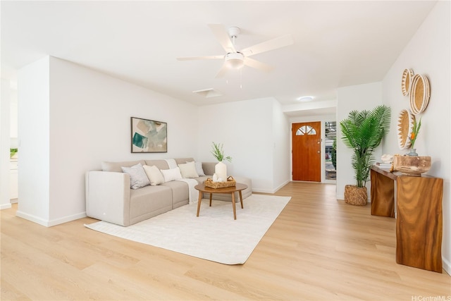 252 Anapalau St, Honolulu, HI 96825 - living room with light wood finished floors, baseboards, and ceiling fan