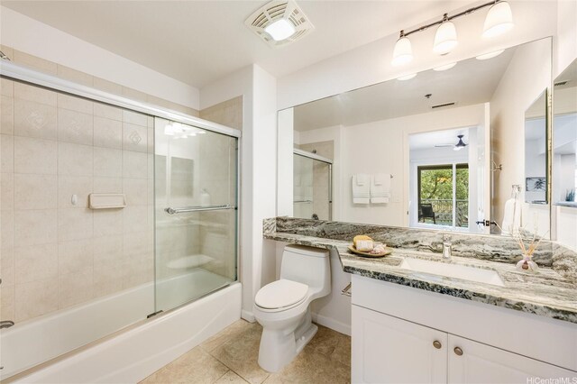 520 Lunalilo Home Rd Unit 7217, Honolulu, HI 96825 - full bath featuring toilet, tile patterned floors, vanity, bath / shower combo with glass door, and a ceiling fan