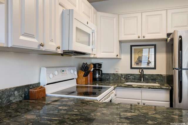 2140 Kuhio Ave Unit 1103, Nuc Honolulu, HI 96815 - kitchen with white appliances, a sink, white cabinets, and dark stone counters