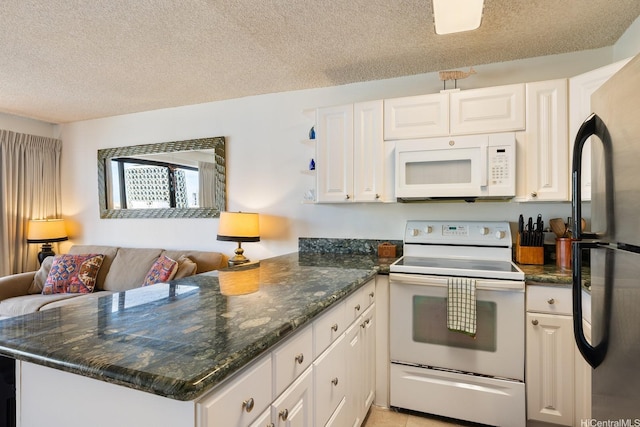 2140 Kuhio Ave Unit 1103, Nuc Honolulu, HI 96815 - kitchen featuring white appliances, a peninsula, a textured ceiling, and white cabinets