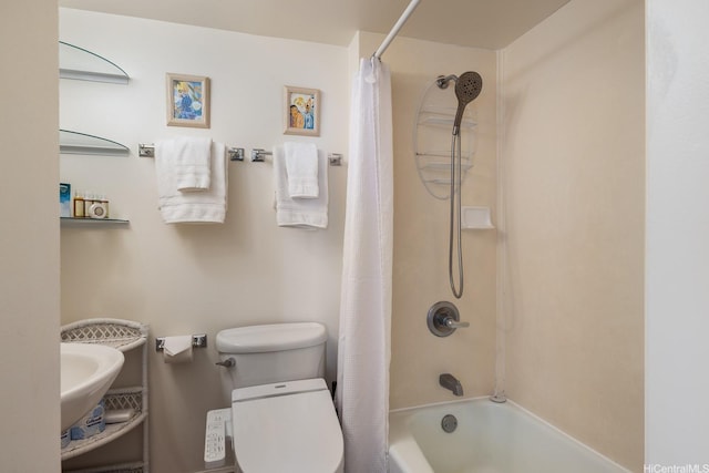 2140 Kuhio Ave Unit 1103, Nuc Honolulu, HI 96815 - full bathroom featuring toilet, shower / bath combo with shower curtain, and a sink