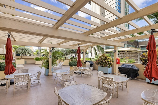 2140 Kuhio Ave Unit 1103, Nuc Honolulu, HI 96815 - view of patio / terrace with outdoor dining space, a grill, and a pergola