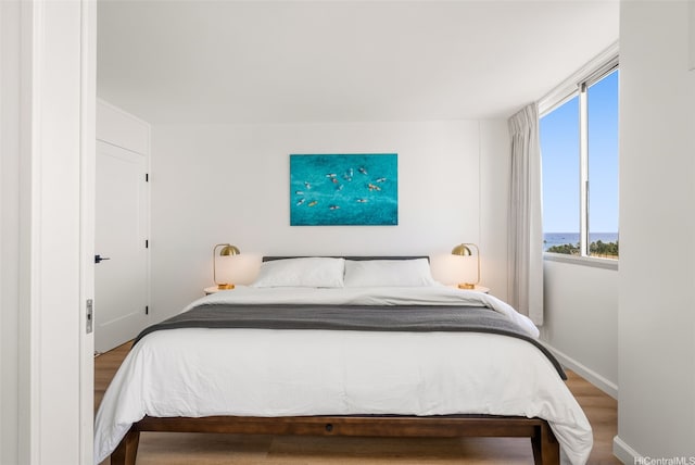 1765 Ala Moana Blvd Unit 990, Honolulu, HI 96815 - bedroom featuring wood finished floors and baseboards