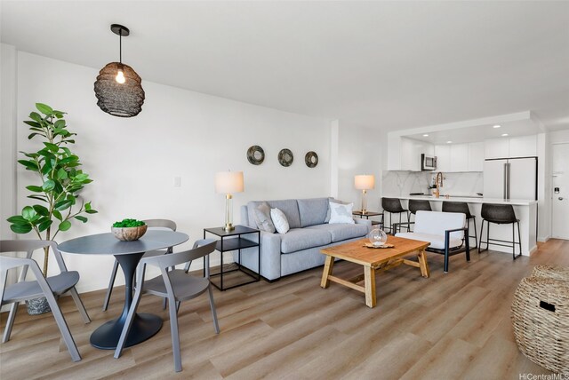 1765 Ala Moana Blvd Unit 990, Honolulu, HI 96815 - living area featuring light wood finished floors and recessed lighting
