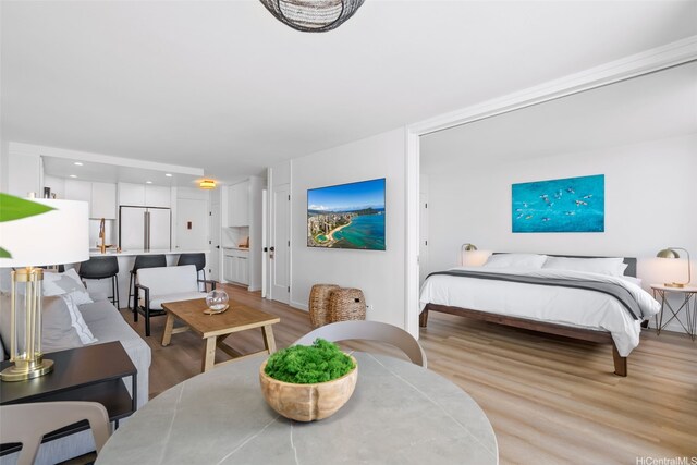 1765 Ala Moana Blvd Unit 990, Honolulu, HI 96815 - bedroom featuring high end fridge, light wood-style flooring, and recessed lighting