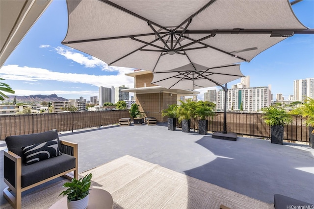 2638 Nakookoo St Unit 501, Honolulu, HI 96826 - view of patio / terrace featuring a city view and a mountain view