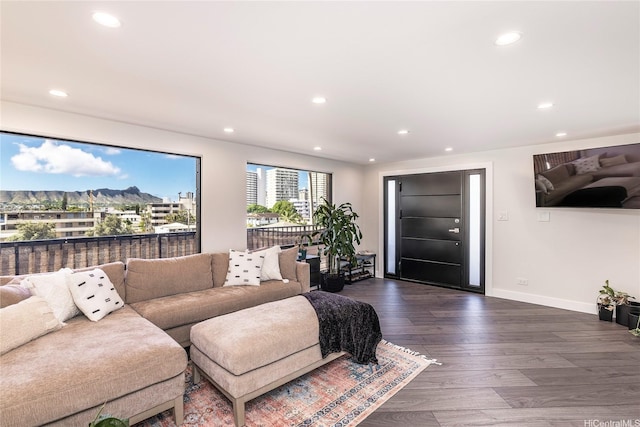 2638 Nakookoo St Unit 501, Honolulu, HI 96826 - living room with recessed lighting, dark wood finished floors, baseboards, and a mountain view