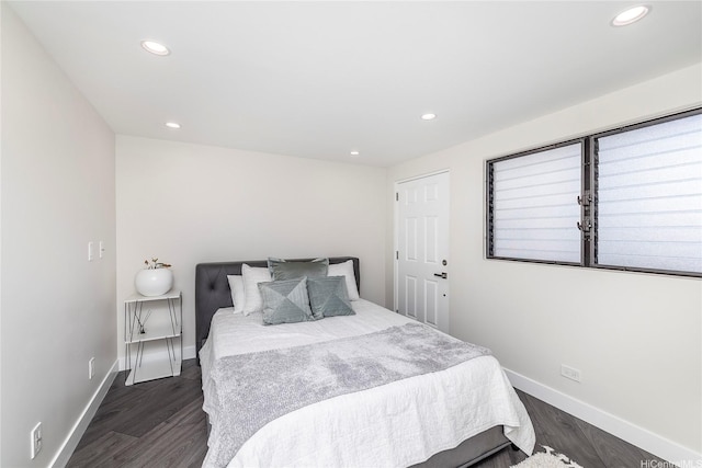 2638 Nakookoo St Unit 501, Honolulu, HI 96826 - bedroom featuring baseboards, recessed lighting, and dark wood-style flooring