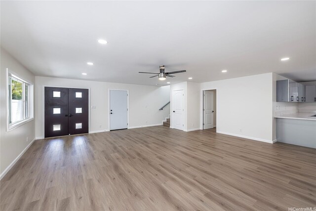 839 Oneawa St, Kailua, HI 96734 - unfurnished living room featuring recessed lighting, light wood finished floors, ceiling fan, stairs, and baseboards