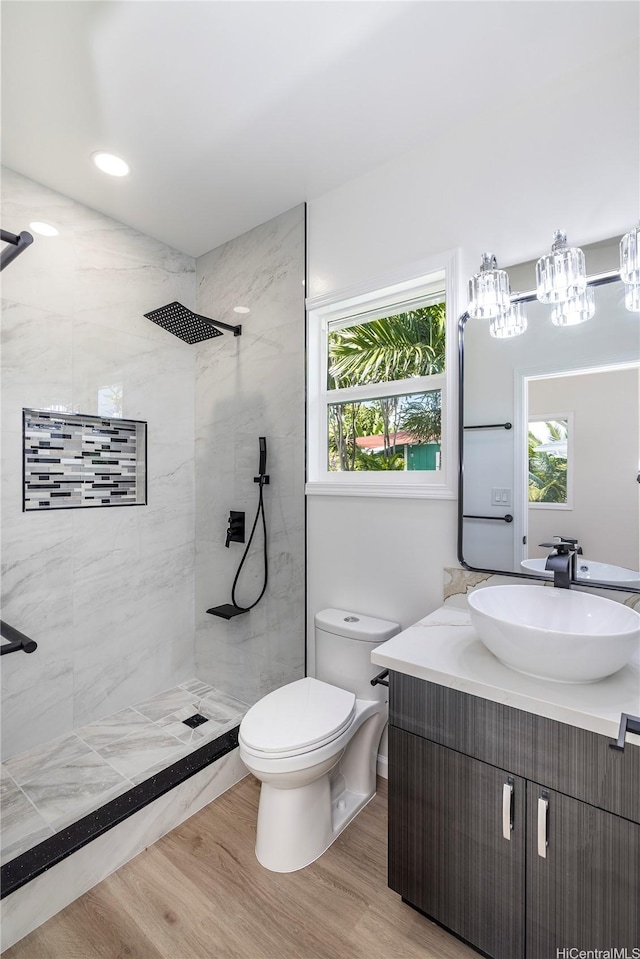 839 Oneawa St, Kailua, HI 96734 - full bath featuring toilet, vanity, tiled shower, and wood finished floors