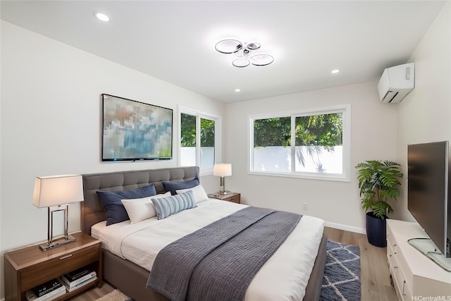 839 Oneawa St, Kailua, HI 96734 - bedroom featuring an AC wall unit, light wood-style floors, baseboards, and recessed lighting