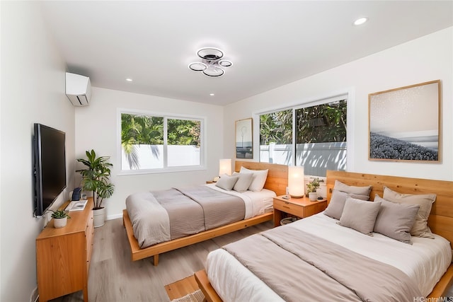 839 Oneawa St, Kailua, HI 96734 - bedroom with a wall unit AC, multiple windows, wood finished floors, baseboards, and recessed lighting