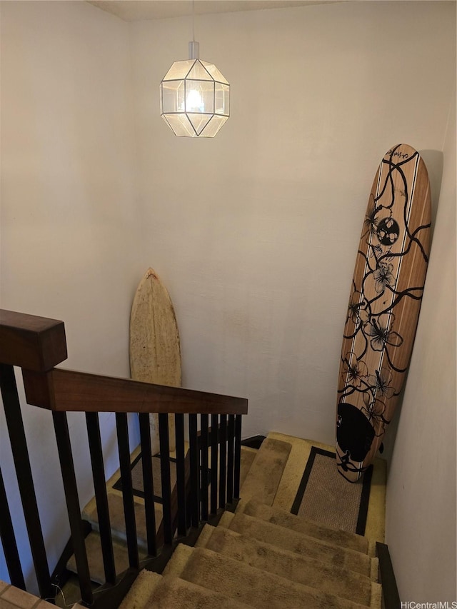 stairs featuring carpet