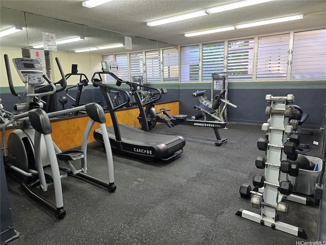 gym with a textured ceiling