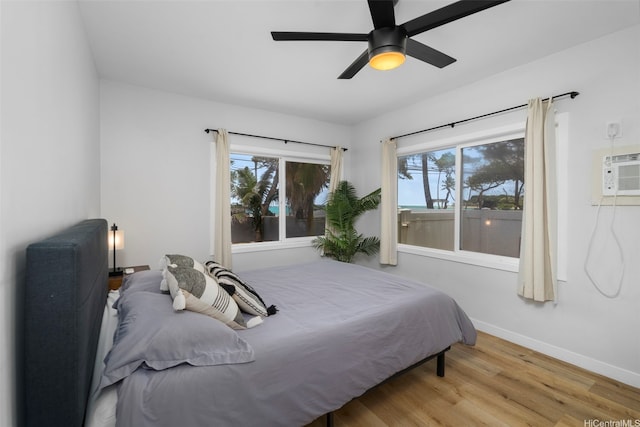 54-100 Kamehameha Hwy, Hauula, HI 96717 - bedroom featuring multiple windows, wood finished floors, baseboards, and a ceiling fan