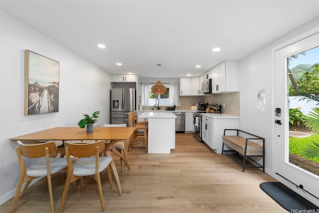 54-100 Kamehameha Hwy, Hauula, HI 96717 - dining room featuring light wood-style floors, recessed lighting, and baseboards