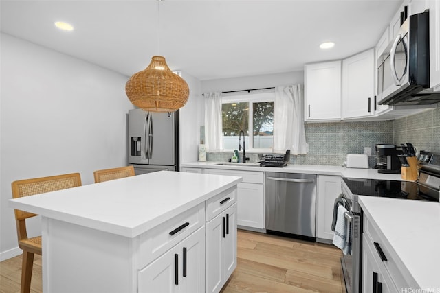 54-100 Kamehameha Hwy, Hauula, HI 96717 - kitchen featuring appliances with stainless steel finishes, a sink, backsplash, a kitchen breakfast bar, and recessed lighting
