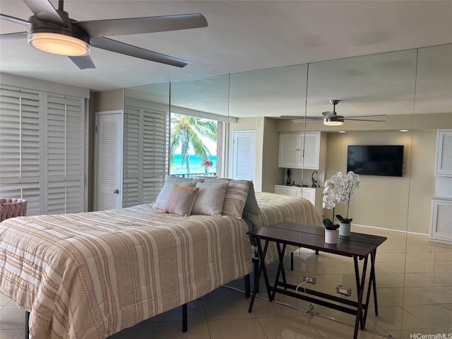 2987KALAKAUAAVENUE703 Kalakaua Ave Unit 703, Honolulu, HI 96850 - bedroom featuring light tile patterned flooring, baseboards, and a ceiling fan