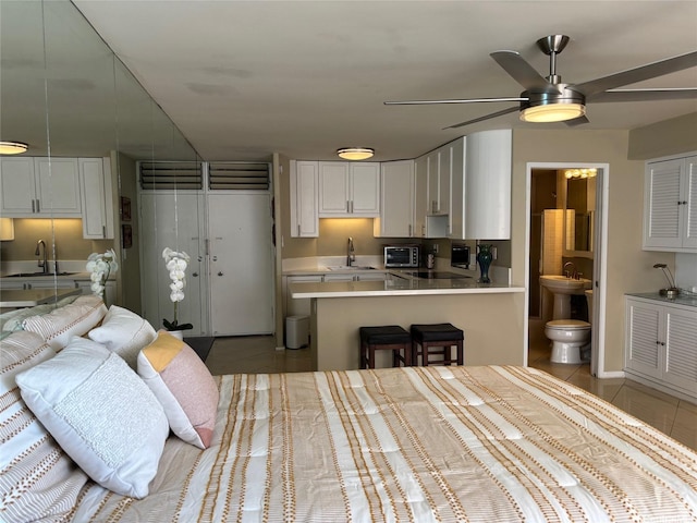 2987KALAKAUAAVENUE703 Kalakaua Ave Unit 703, Honolulu, HI 96850 - kitchen with a sink, light tile patterned floors, and a ceiling fan