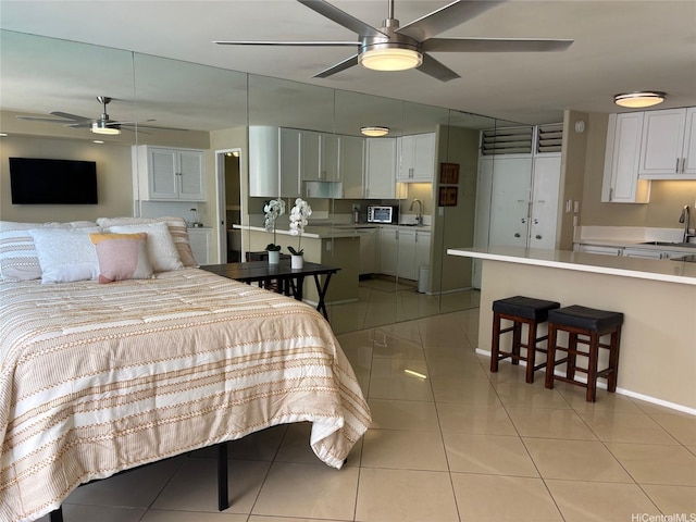 2987KALAKAUAAVENUE703 Kalakaua Ave Unit 703, Honolulu, HI 96850 - bedroom featuring a sink, light tile patterned floors, and baseboards