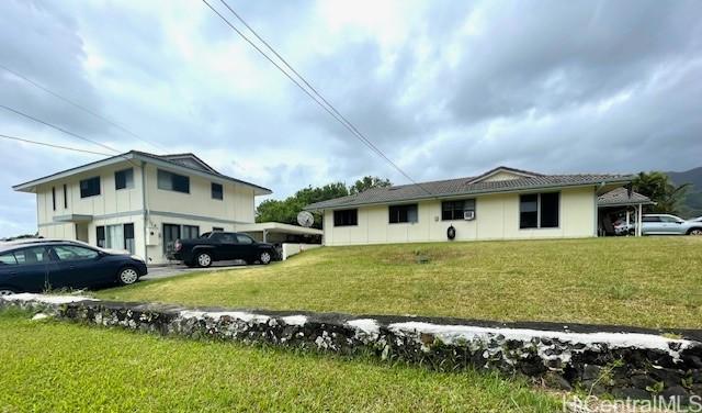 47-166 Wailehua Rd, Kaneohe, HI 96744 - view of side of home featuring a lawn