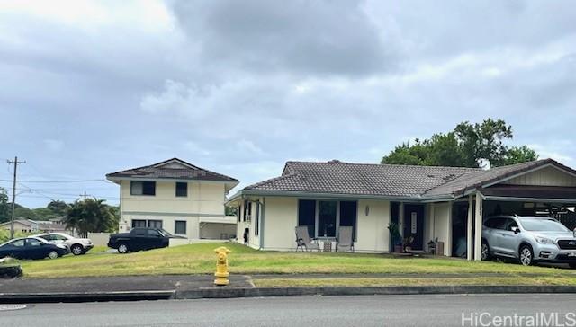 47-166 Wailehua Rd, Kaneohe, HI 96744 - view of front of property with a front lawn, a tile roof, and an attached carport