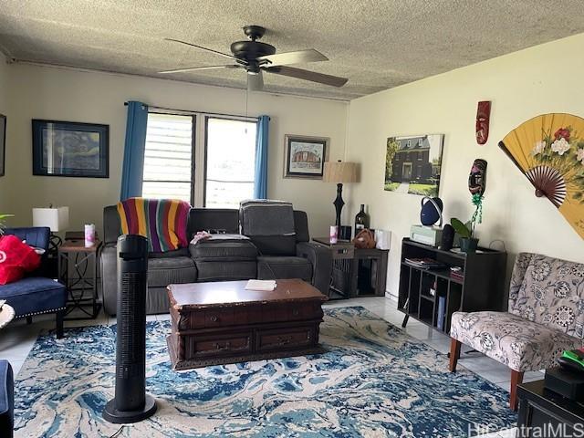 47-166 Wailehua Rd, Kaneohe, HI 96744 - living area featuring ceiling fan and a textured ceiling