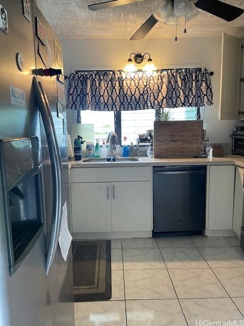 47-166 Wailehua Rd, Kaneohe, HI 96744 - kitchen featuring dishwasher, stainless steel fridge with ice dispenser, a sink, light countertops, and a ceiling fan