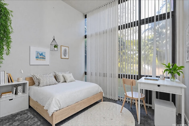 5333 Likini St Unit 110, Honolulu, HI 96818 - bedroom featuring multiple windows and a towering ceiling