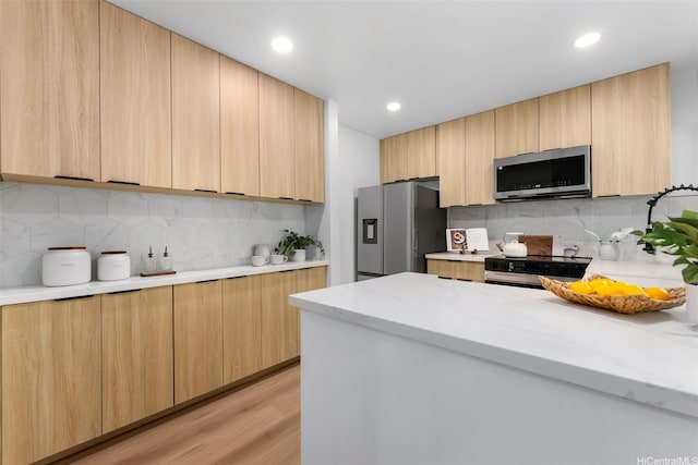 46-160 Kiowai St Unit 2324, Kaneohe, HI 96744 - kitchen featuring stainless steel appliances, modern cabinets, light brown cabinetry, decorative backsplash, and recessed lighting