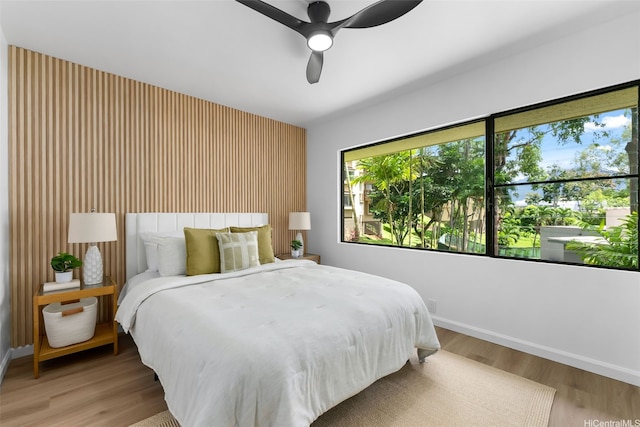 46-160 Kiowai St Unit 2324, Kaneohe, HI 96744 - bedroom with baseboards, light wood-style floors, and ceiling fan