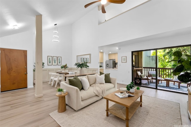 46-160 Kiowai St Unit 2324, Kaneohe, HI 96744 - living room with light wood-style floors, a ceiling fan, high vaulted ceiling, and baseboards