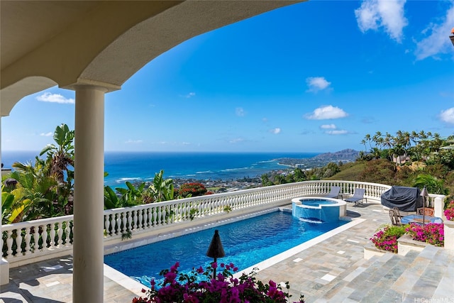 671 Kahiau Loop, Honolulu, HI 96821 - view of pool featuring a pool with connected hot tub, a patio, and a water view