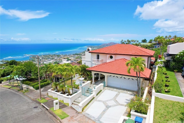 671 Kahiau Loop, Honolulu, HI 96821 - view of front of home featuring stucco siding, a tiled roof, a garage, a balcony, and driveway