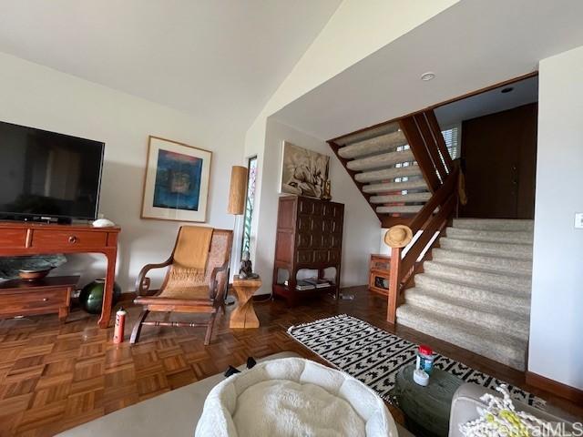 389 Kaelepulu Dr Unit 1501, Kailua, HI 96734 - living area featuring stairway, baseboards, and lofted ceiling