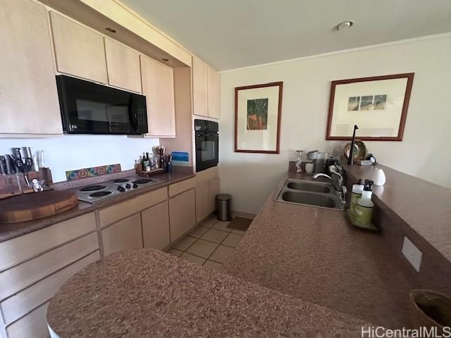 389 Kaelepulu Dr Unit 1501, Kailua, HI 96734 - kitchen with black appliances, a sink, light tile patterned floors, and dark countertops