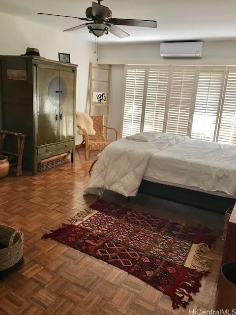 389 Kaelepulu Dr Unit 1501, Kailua, HI 96734 - bedroom with a wall mounted air conditioner and a ceiling fan