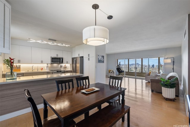 999 Wilder Ave Unit 1603, Honolulu, HI 96822 - dining space with light wood-type flooring