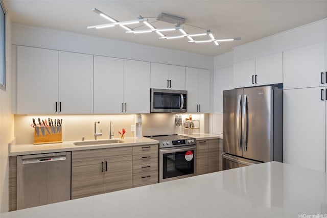 999 Wilder Ave Unit 1603, Honolulu, HI 96822 - kitchen with appliances with stainless steel finishes, light countertops, white cabinets, and modern cabinets