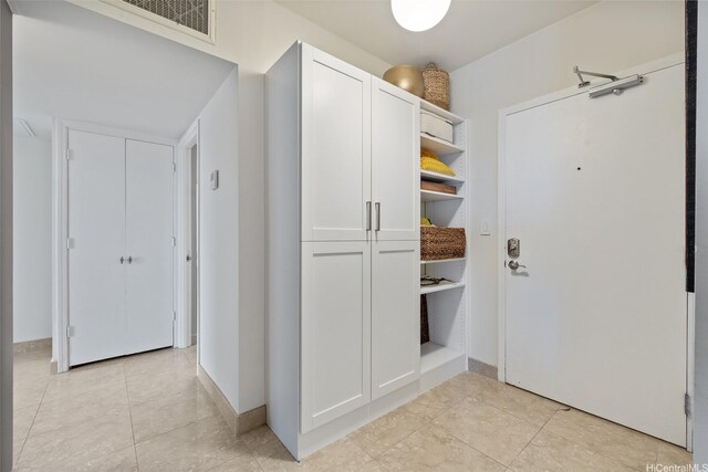 999 Wilder Ave Unit 1603, Honolulu, HI 96822 - mudroom with light tile patterned flooring and baseboards